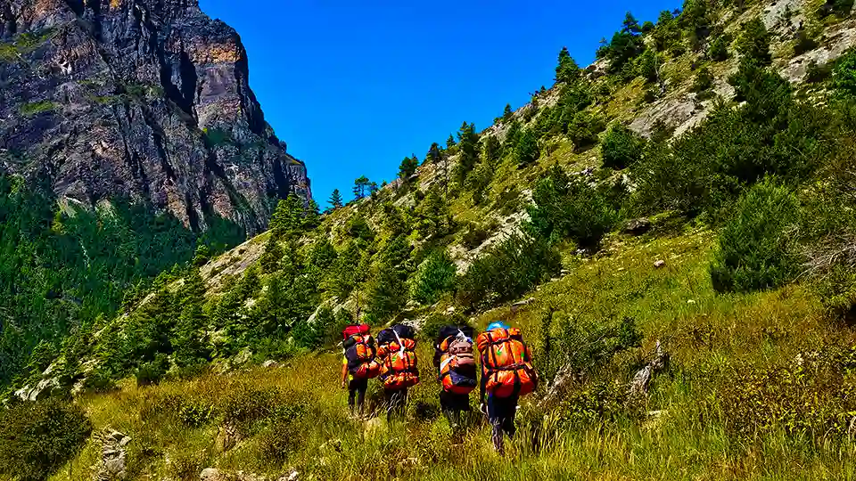 Porter Posing for a Photo in arid landscape of Manang