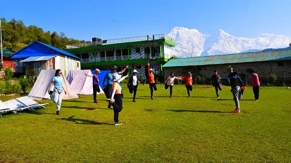 Mardi Himal Trek 5 Days 3 Trekkers Warm Up during First day Mardi Trek